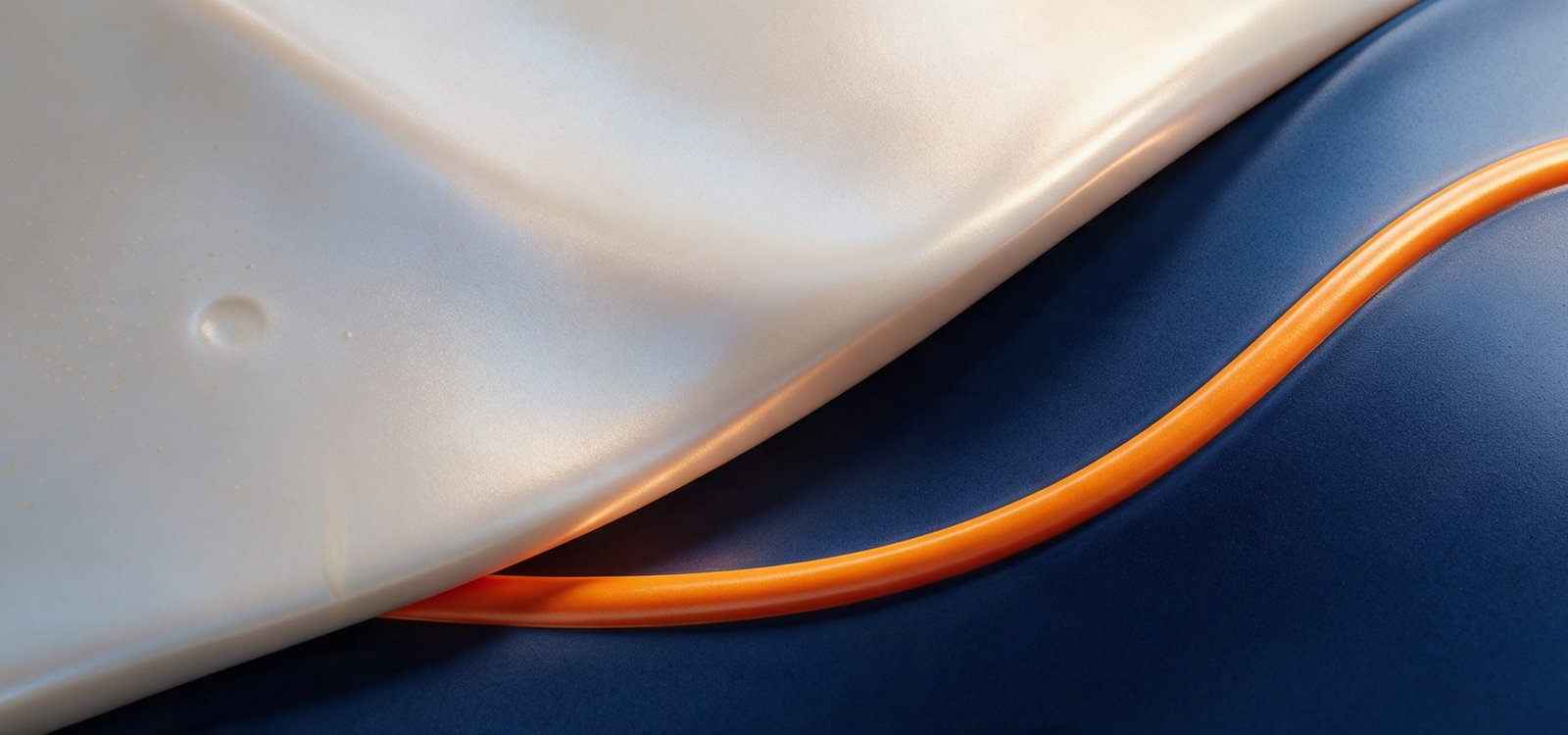 Abstract artwork of a smooth pearlescent ceramic surface with soft light refraction and a single sweeping orange arc across a navy field